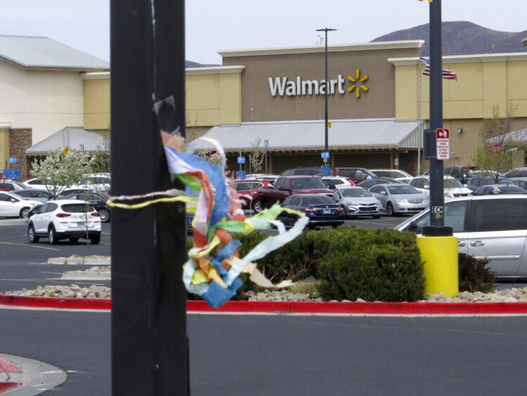 A ribbon flutters in the parking lot outside a Walmart store in Fernley, Nev., on Friday, April 8, 2022, where authorities say 18-year-old Naomi Irion was abducted last month before she was killed and buried in the northern Nevada desert. A judge has ordered Troy Driver, of nearby Fallon, to be held in jail without bail on first-degree murder, kidnapping and other charges in her death. (AP Photo/Scott Sonner)