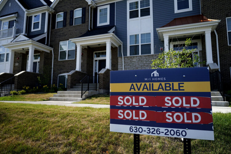 FILE - An advertising sign for building land stands in front of a new home construction site in Northbrook, Ill., Wednesday, June 23, 2021. Long-term U.S. mortgage rates rose for the seventh straight week, climbing to their highest level in more than a decade. The average rate on a 30-year mortgage rose to 5.11% from 5% last week, mortgage buyer Freddie Mac reported Thursday, April 21, 2022. (AP Photo/Nam Y. Huh, File)