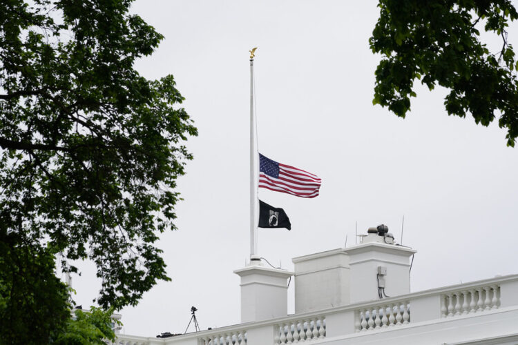 The American flag flies at half-staff at the White House in Washington, Thursday, May 12, 2022, as the Biden administration commemorates 1 million American lives lost due to COVID-19. (AP Photo/Susan Walsh)